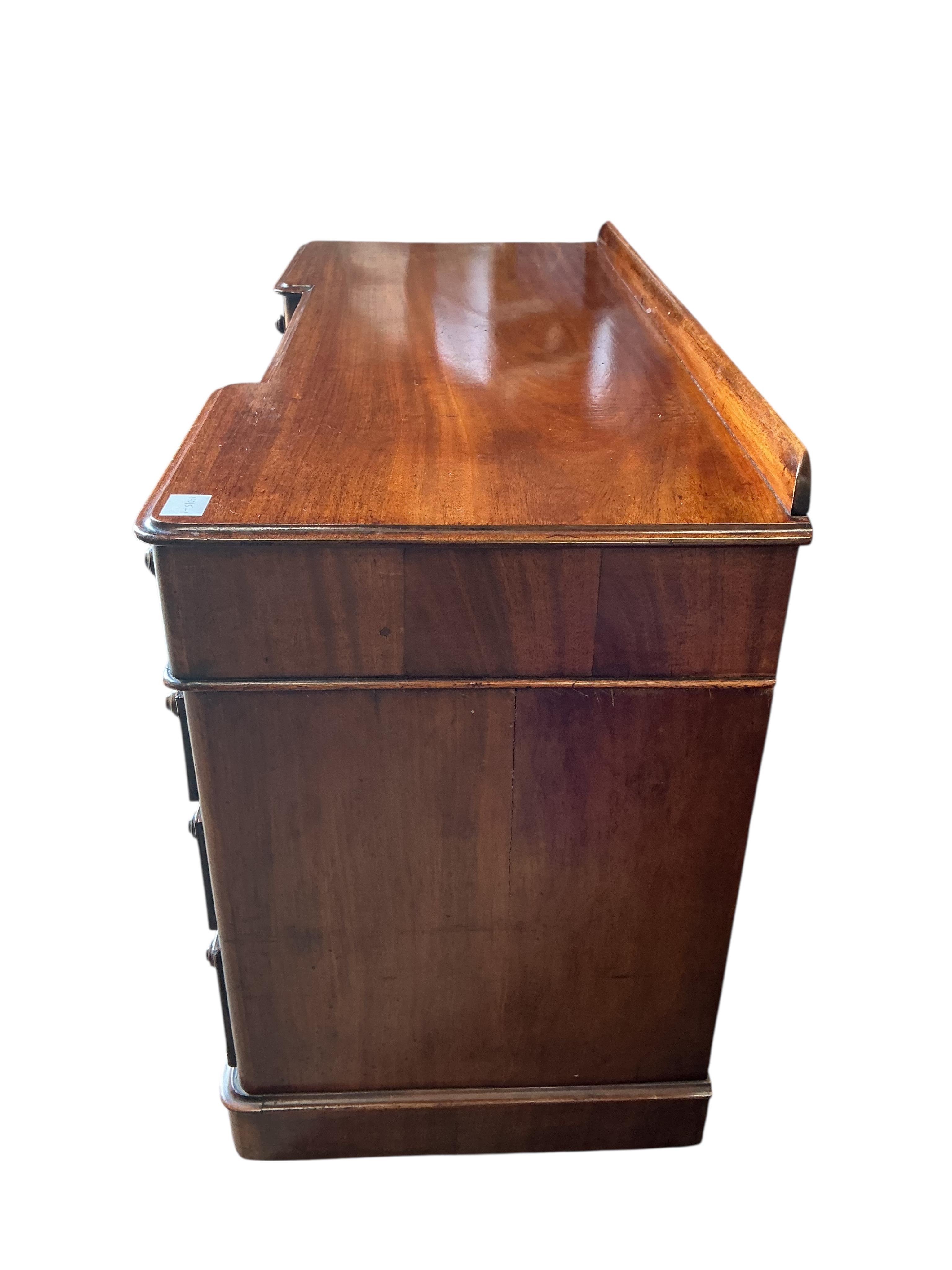 A Victorian mahogany inverse breakfront pedestal dressing table, width 120cm, depth 52cm, height 80cm